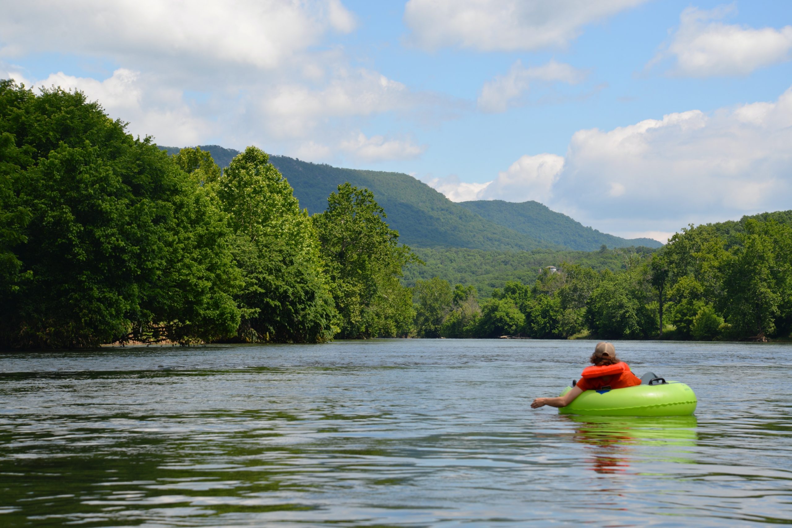 Tube Floats Downriver Canoe Company