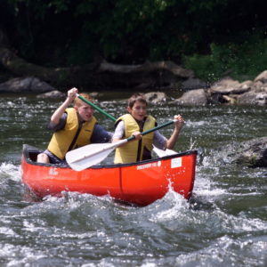 two teen boys enjoying their canoe trip Downriver Canoe Company Shenandoah Valley River