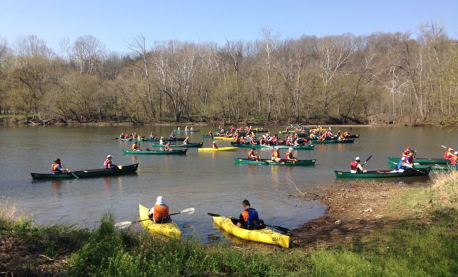 large canoe and kayak group are about to race each other Downriver Canoe Company Shenandoah Valley River