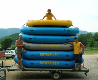 three employees have loaded up rafts on the trailer and are ready to go Downriver Canoe Company Shenandoah Valley River