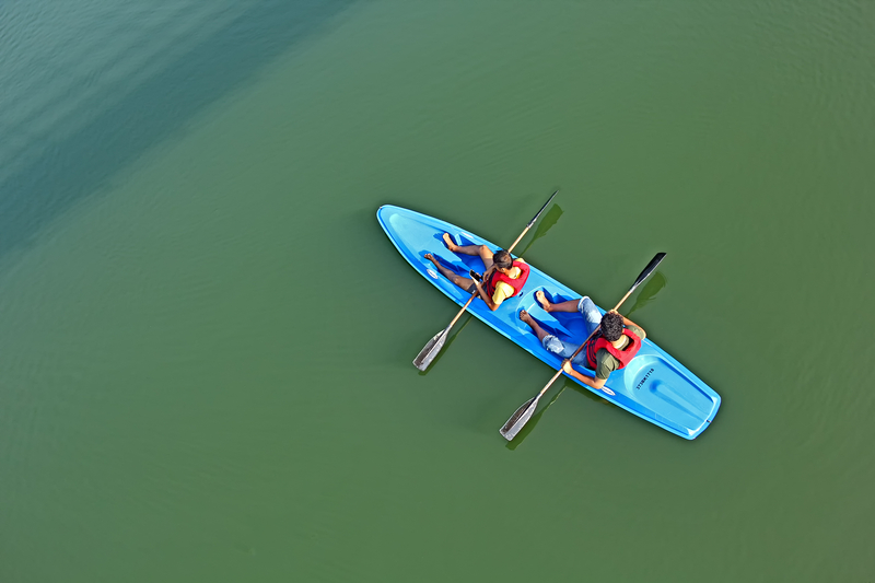 two men in a tandem kayak