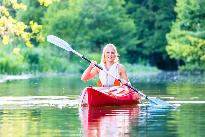 woman in a sit inside kayak